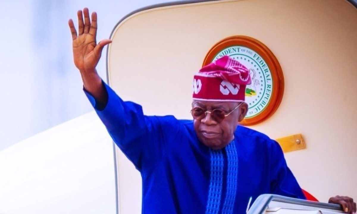 President Bola Ahmed Tinubu waves to the crowd as he arrives in Abuja, dressed in traditional attire, following his diplomatic visits to Japan and Brazil.