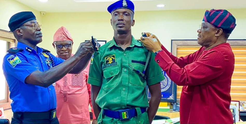 Governor Okpebholo decorating newly promoted police officers at a ceremony in Edo State, 2025