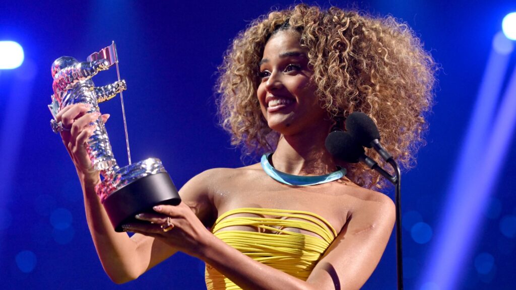 Tyla holding her Best Afrobeats award at the 2025 VMAs, celebrating on stage as Nigerian nominees miss out.