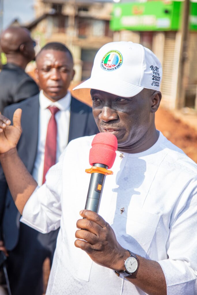 overnor Monday Okpebholo walking through Sapele Road in Benin City during an inspection of ongoing road construction projects, engaging with residents and inspecting drainage and road quality