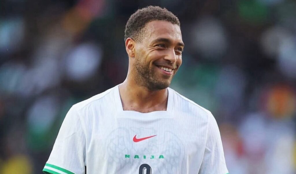 Super Eagles players on the field during the match against South Africa, showing a tense moment.