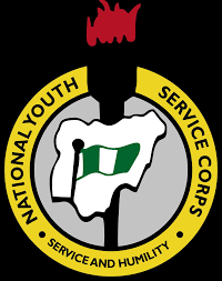 Prospective NYSC members in orientation camp gear, holding documents, as FG enforces new mobilisation rules requiring NERD compliance.