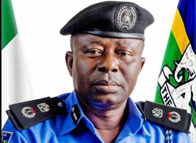 police officer standing with arms crossed, symbolizing investigation and law enforcement in Abuja